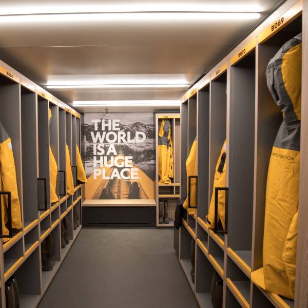 A ready room where Quark Expedition parks hang in their open lockers