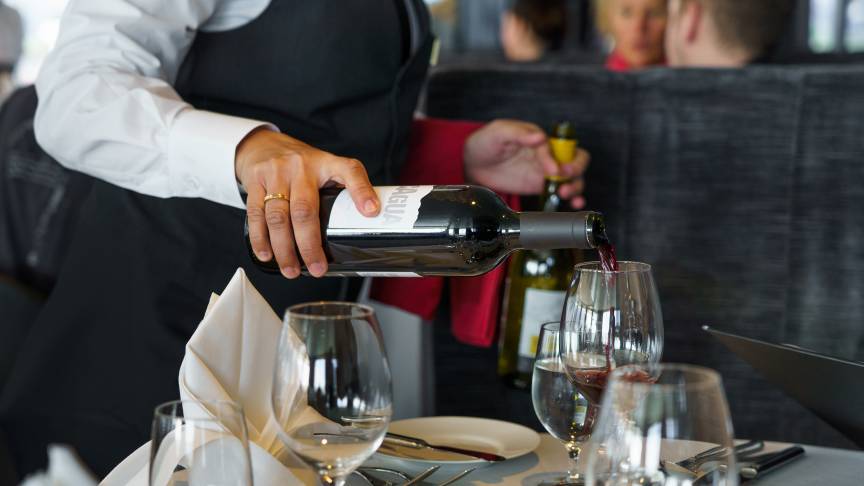 Wine being served to Ultramarine guests in the Balena Restaurant