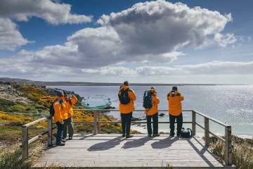 Passengers viewing the coast