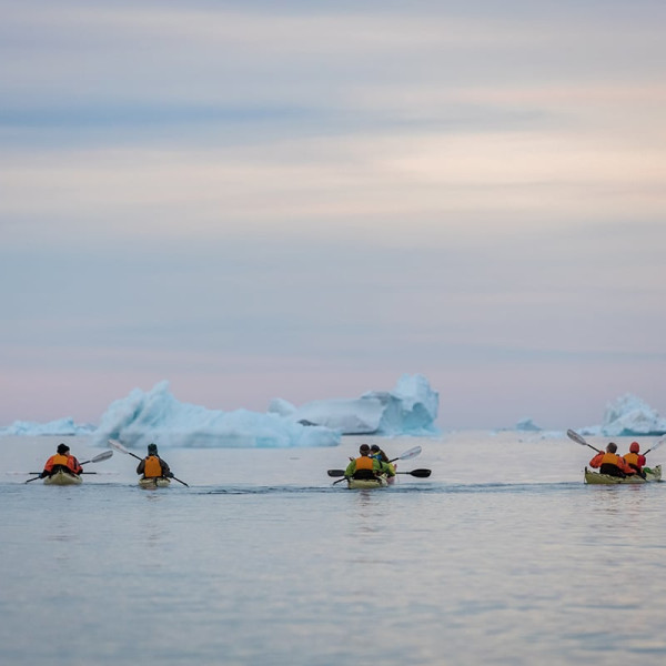 Quark Expeditions guests kayaking in the Arctic, one of the many off-ship activities available on polar voyages.