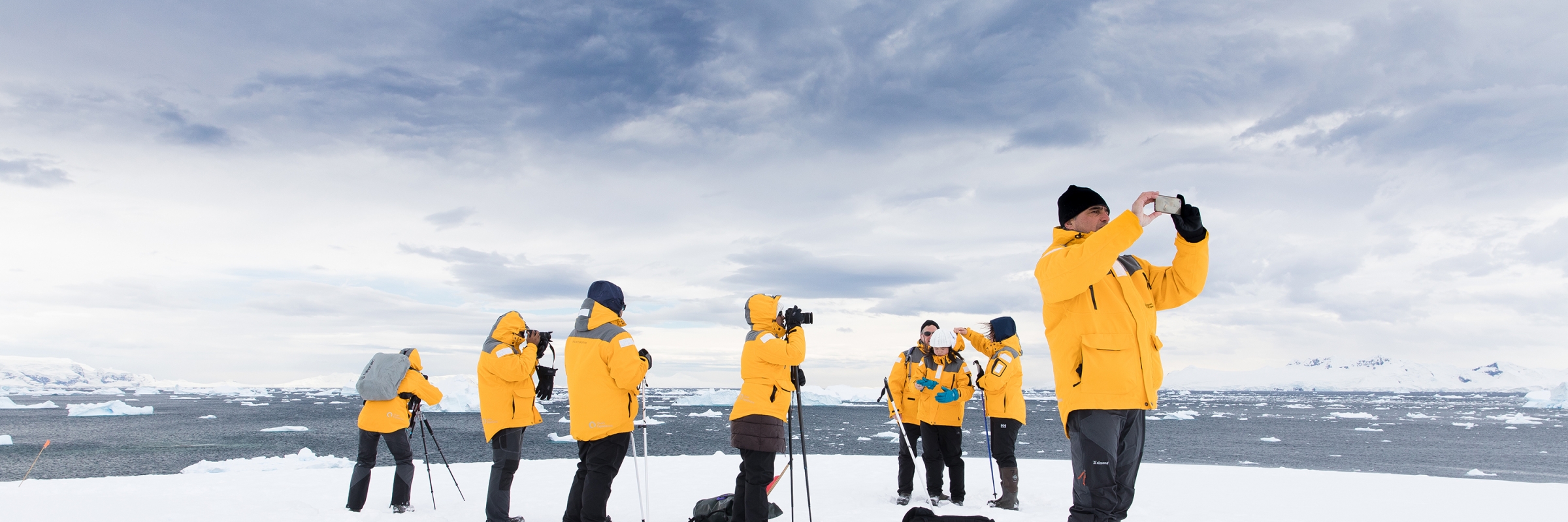 Guests enjoying Antarctic landscapes on a landing at Portal Point. Photo by Sam Edmonds.
