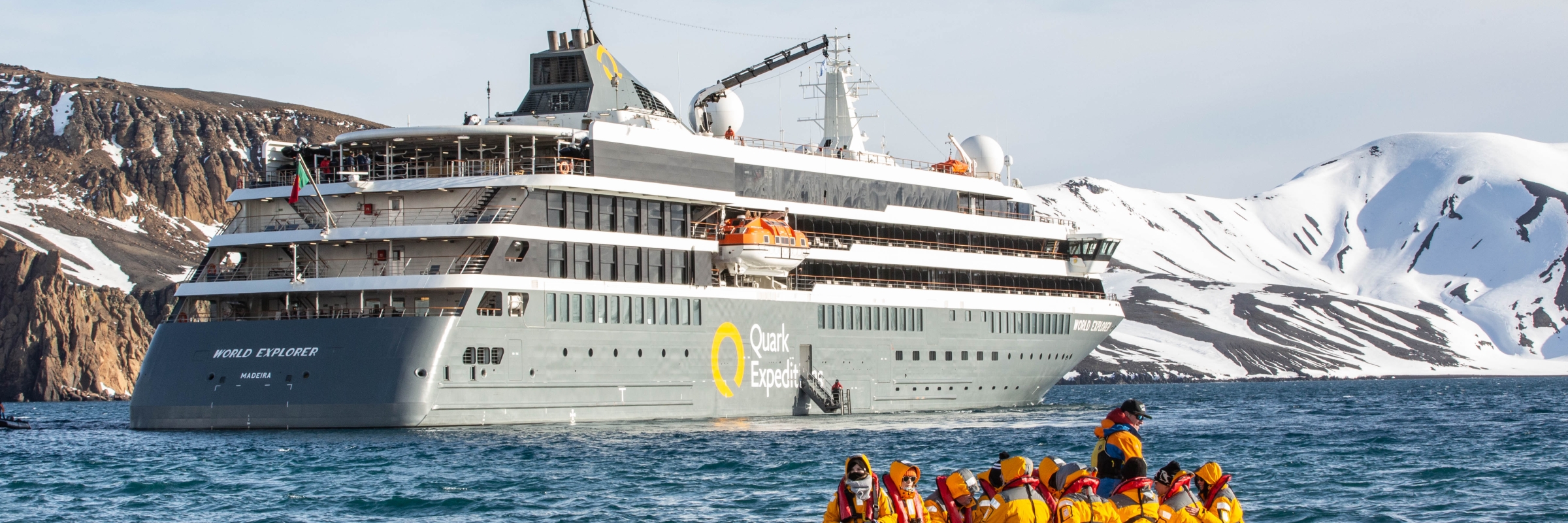 Guests in a zodiac cruise ready to explore Deception Island, Antarctica. 