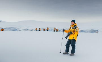 Passengers hiking in Antarctic Landscape