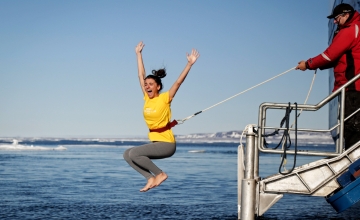 Passenger enjoying the polar plunge experience in Svalbard